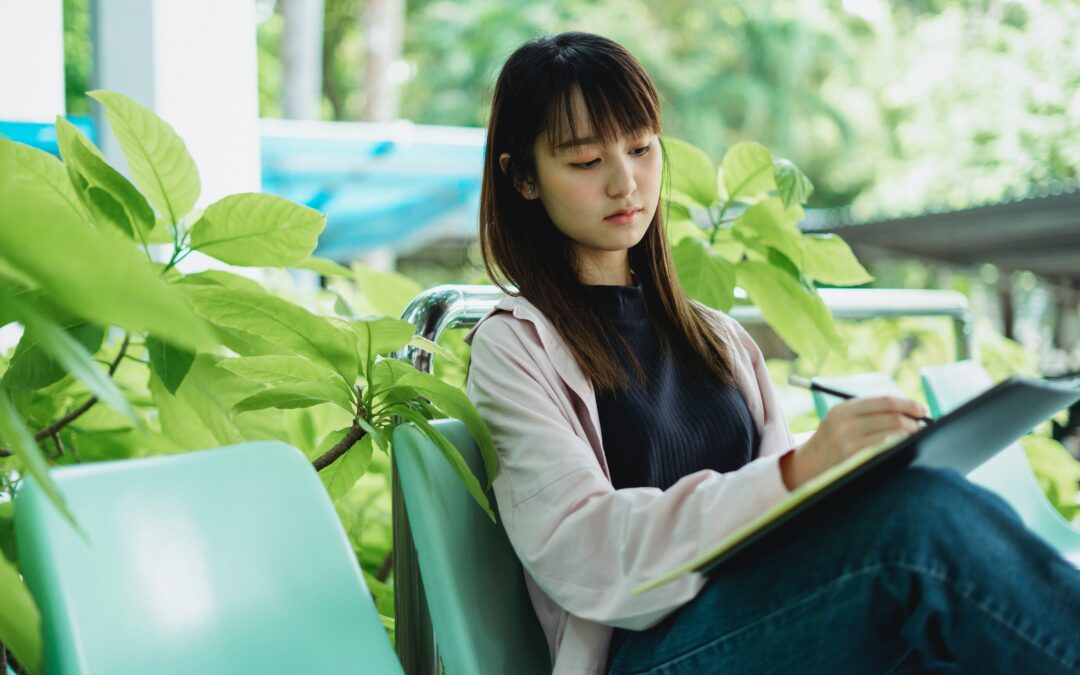 Female student sitting with book